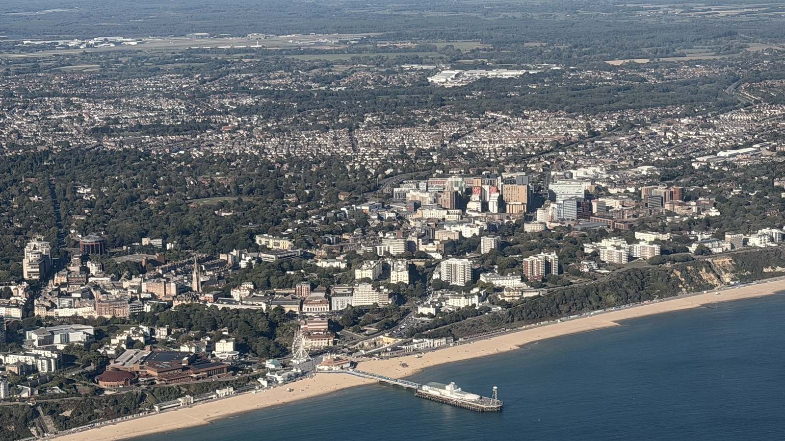 Aerial view of Bournemouth town centre, the pier and the beach from the west