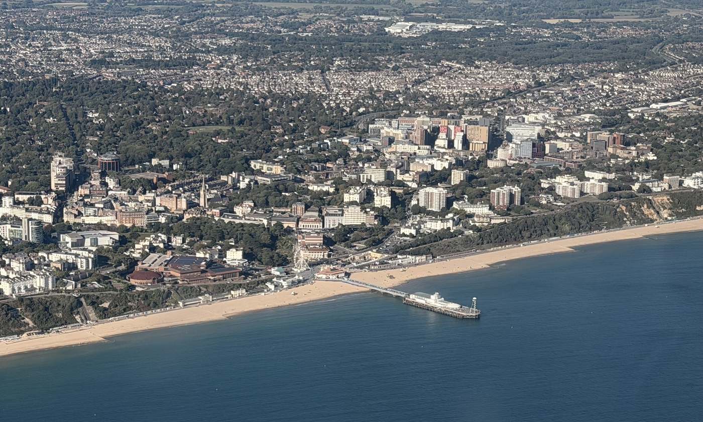 Aerial view of Bournemouth pier, the beach and the town centre
